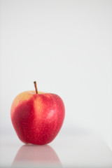 One red apple isolated on white background vertical