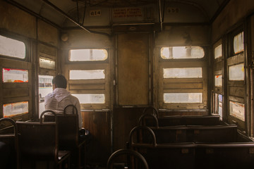 Fototapeta premium A passenger sitting in a Tram in Kolkata, West Bengal, India. 