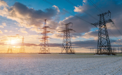 Fototapeta na wymiar Power lines during a beautiful winter sunset.