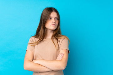 Ukrainian teenager girl over isolated blue background portrait