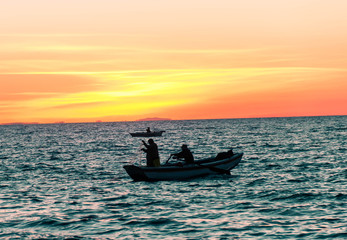 fishing in the sunset Titicaca Bolivia