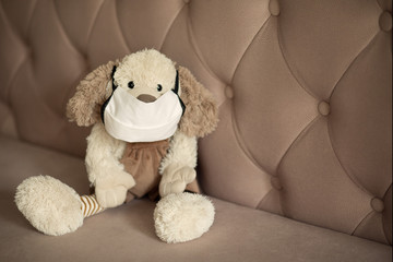 
Children's toy in a medical mask from coronavirus