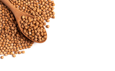 Dry organic chickpeas in a wooden spoon isolated on white background with space. Top view. 
