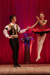Duet young girl ballerina and a young man dancing ballet performance on stage in a theater © Kozlik_mozlik
