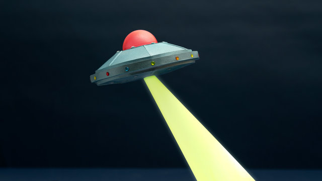 Illustration of UFO in sky at night