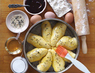 Homemade cakes in a shape for baking on a cutting Board with ingredients.