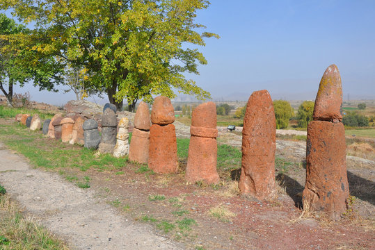 Menhirs stand in a row on the territory of the Metsamor Museum-Reserve. Armenia