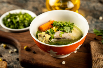 Chicken soup with herbs and green salad