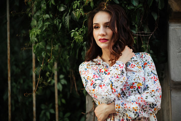 beautiful girl on a field of flowers in a beautiful dress