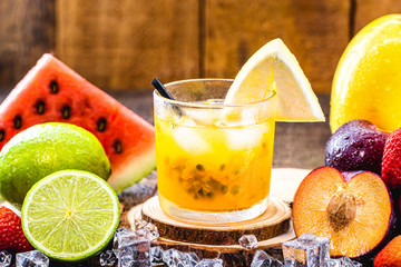 Brazilian caipirinha, typical Brazilian cocktail made with passion fruit, cachaça and sugar. Traditional drink from Brazil known as caipifruta, with thefts around.