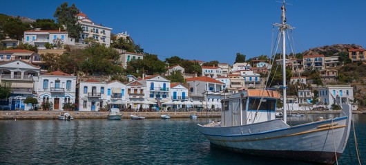 Fototapeta na wymiar panoramic view to the beautiful port of Evdilos on the Greek Island Ikaria, banner, panorama