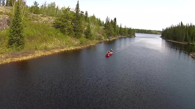 Paddling in the rocky Canadian Shield country of eastern Manitoba - medium shot
