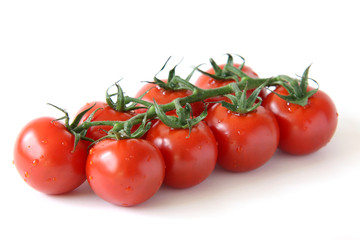 Mini panicle tomatoes on white background