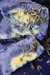 Obraz premium Hand made lavender soaps on the blue background. Natural cosmetic. Home business. Voluntary Isolation. Zero waste