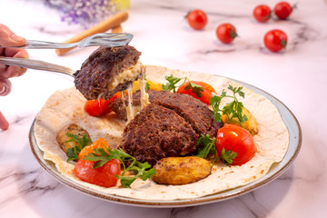 grilled meatballs served with butter