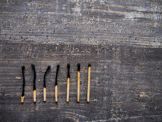 dead matches on the wooden table