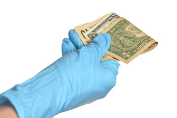 Hand in blue protective gloves with money isolated on white background.