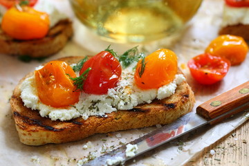 Bruschetta with ricotta cheese and sun-dried tomatoes with provencal herbs.