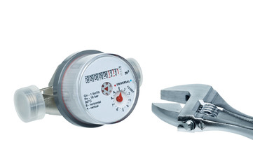 New water meter and wrench isolated on white background.
