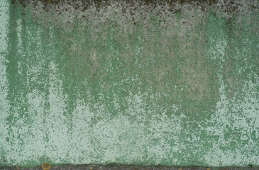 remnants of paint on the scrubbed weathered wall