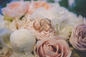 wedding rings and bouquet