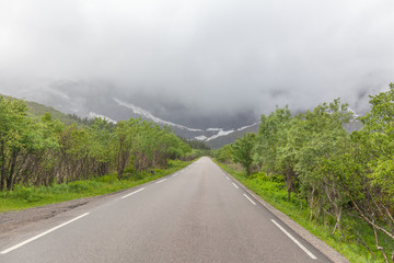 Fototapeta na wymiar view of an empty winding road at the Lofoten islands