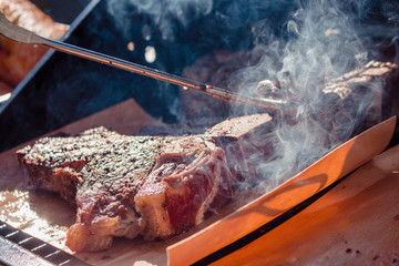 Close-up of beef T-Bone-Steaks grilling on a barbecue