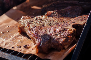 Close-up of beef T-Bone-Steaks grilling on a barbecue
