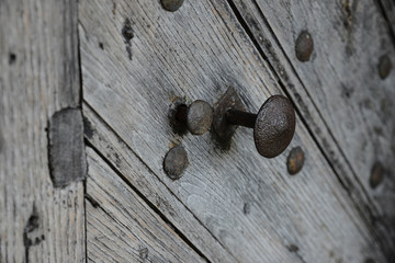 metal knob of vintage wooden door