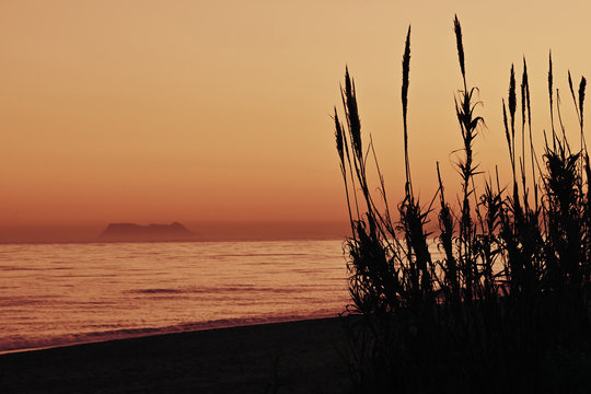 Romantic sunset from the beach  with beautiful view to Gibraltar