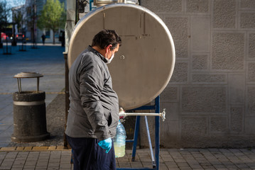 pouring water tanks on the street during the covid 19