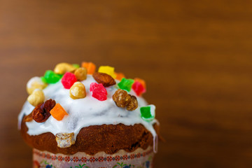 Easter cake, chocolate eggs on a wooden background. Selectiv focus. Blurred background