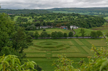 Fototapeta na wymiar View of the Scottish countryside with creatively landscaped green meadows, Stirling, UK