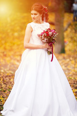 Fototapeta na wymiar Beautiful bride outdoors in a forest. Wedding day