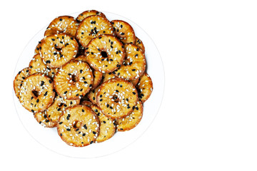 biscuit crackers with sesame seeds, isolated with space for text
