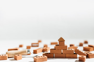 Naklejka na ściany i meble red bricks lie on a white background building materials building a house