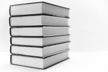 A stack of books isolated on a white background. 