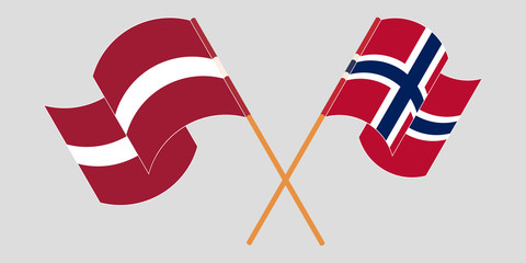 Crossed and waving flags of Latvia and Norway