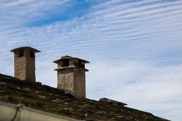 Fototapeta na wymiar old stone roof with chimney