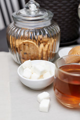 tea and sugar cubes, cookies in a jar