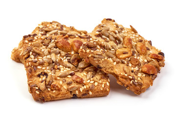 Cookies with nuts and seeds of peanut, sunflower seeds, sesame, linen, organic food, isolated on white background