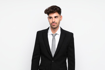 Young businessman over isolated white background standing and looking to the side