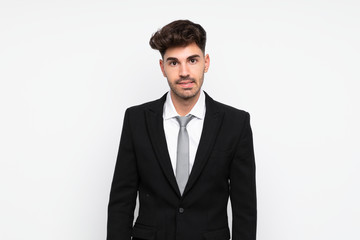 Young businessman over isolated white background having doubts and with confuse face expression