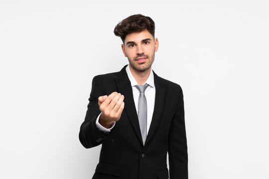 Young businessman over isolated white background inviting to come
