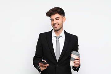 Young businessman holding coffee to take away over isolated white background