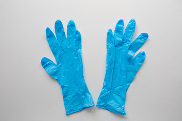 Blue medical gloves on a white background. Copy space. covid-19 protection. Coronavirus Epidemic