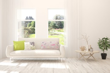 White living room with sofa and summer landscape in window. Scandinavian interior design. 3D illustration