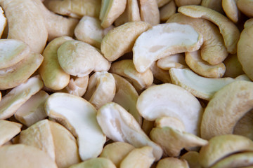 Organic cashews fried without shell on the whole background. macro, macro photography