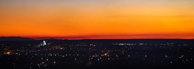 Sunset on the background of the city in spring