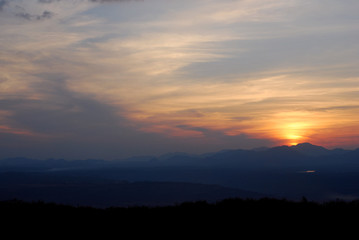 Fototapeta premium Sunrise among forests and mountains